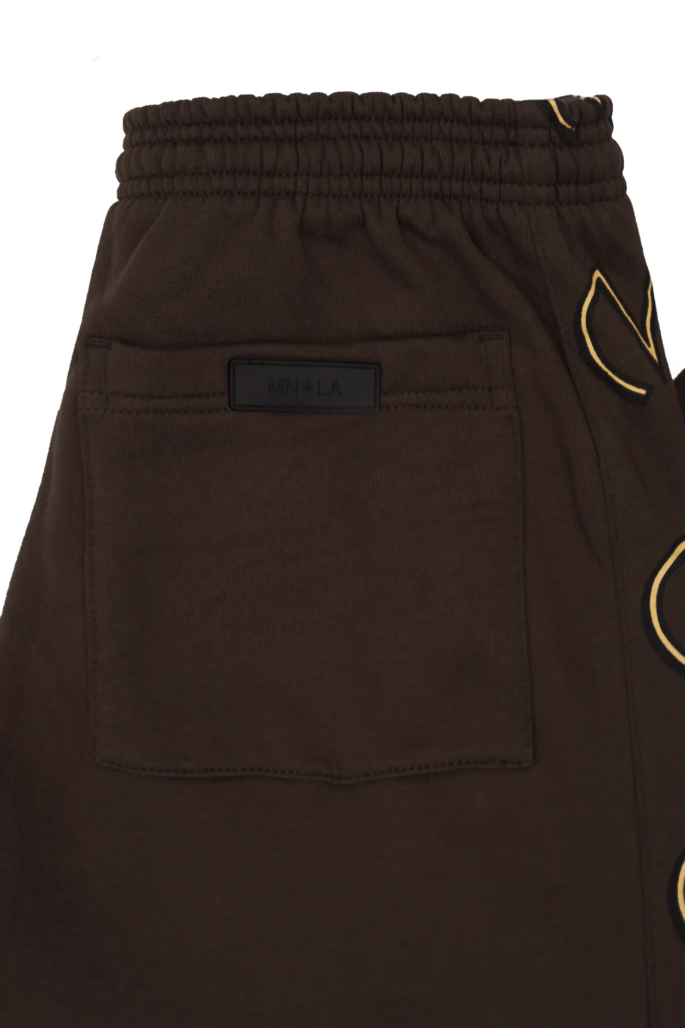 "M'$ & BEYOND" TRACK PANTS IN WOOD