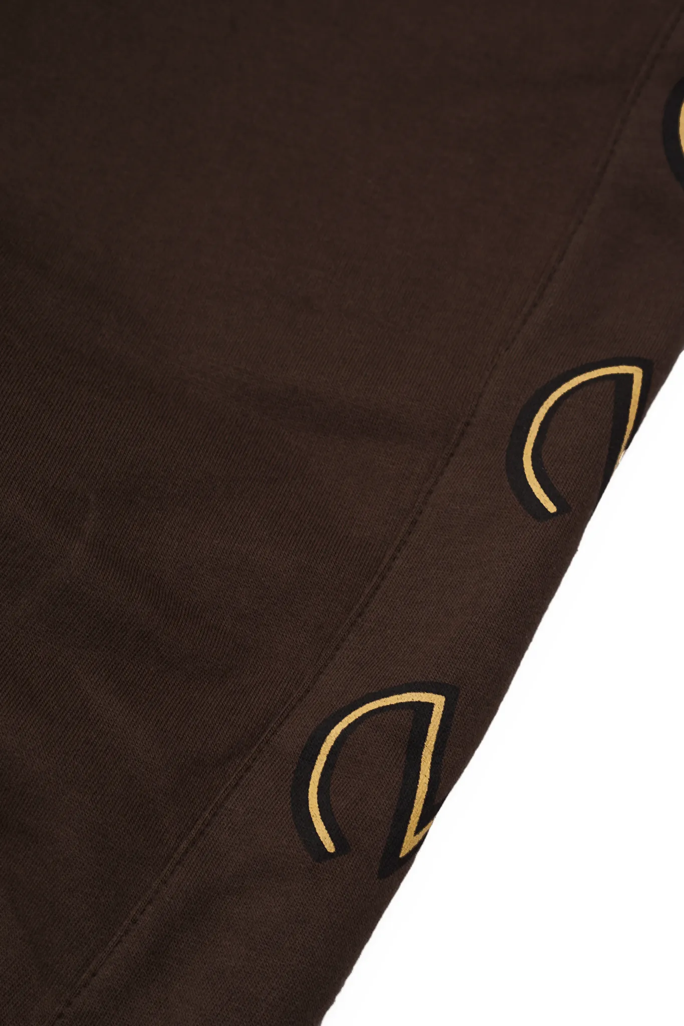 "M'$ & BEYOND" TRACK PANTS IN WOOD