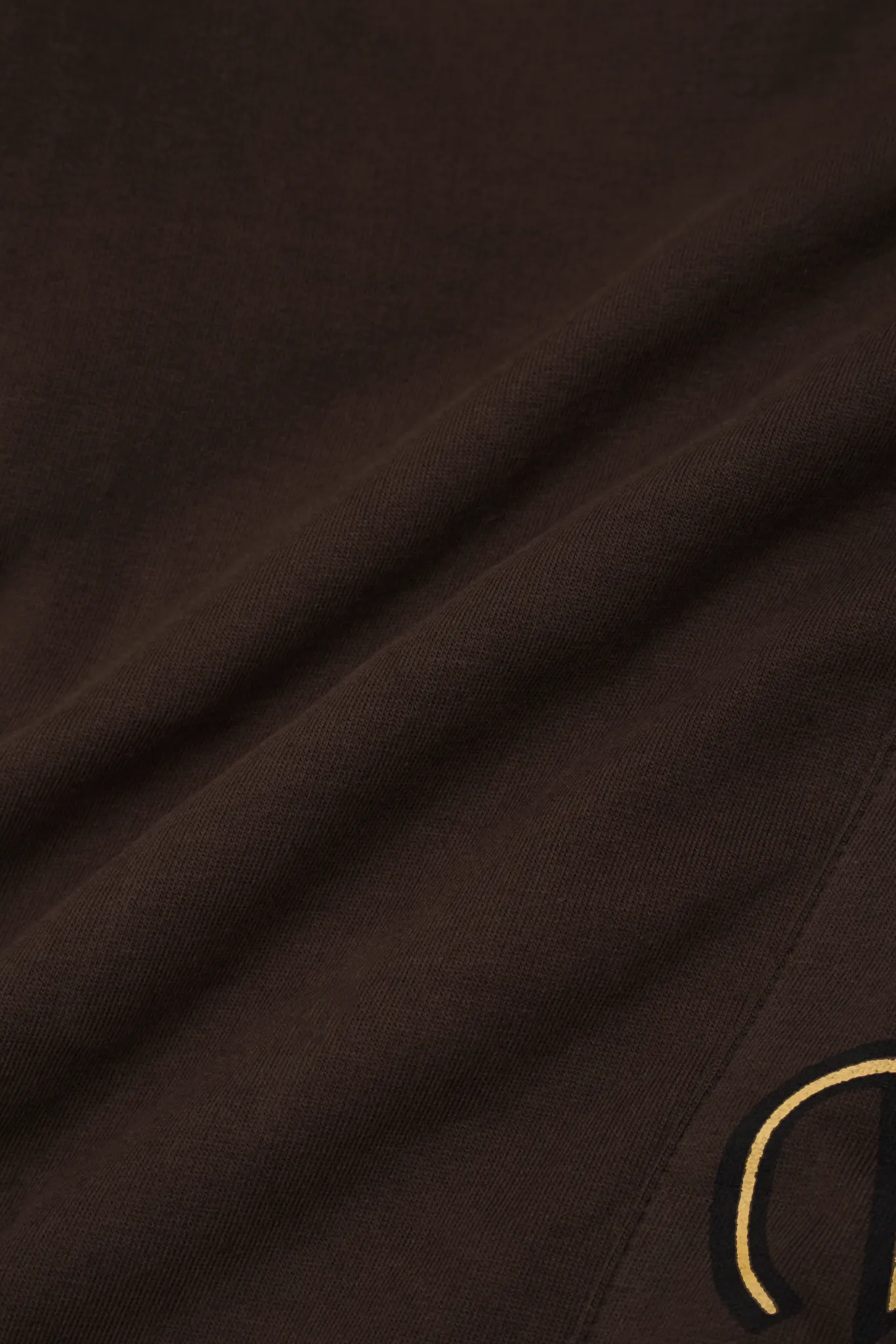 "M'$ & BEYOND" TRACK PANTS IN WOOD